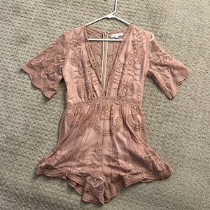 Romper that’s lined. Except back is sheer and zips up. Pink/mauve color.